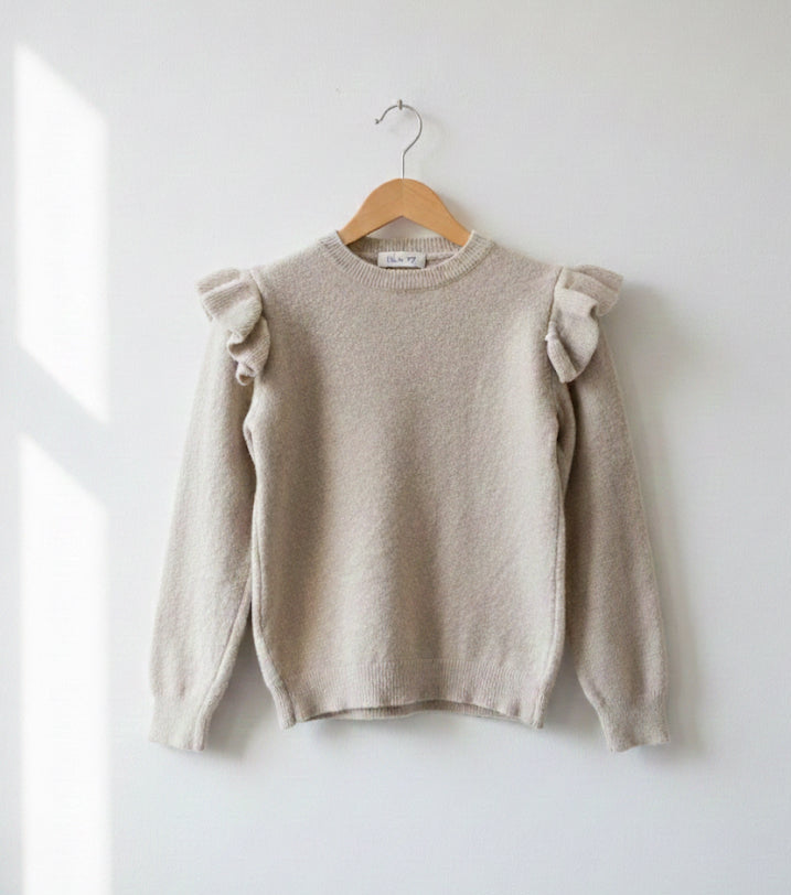 Suéter de lana con volantes en hombros.