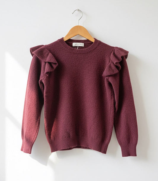 Suéter de lana con volantes en hombros.